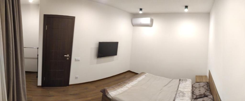 TV a/nebo společenská místnost v ubytování Apartments Duplex Odesa