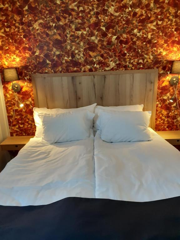 Postel nebo postele na pokoji v ubytování Hotell Greven
