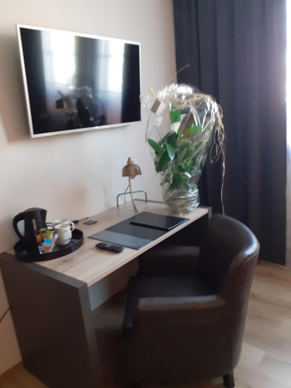 TV a/nebo společenská místnost v ubytování Hotell Greven