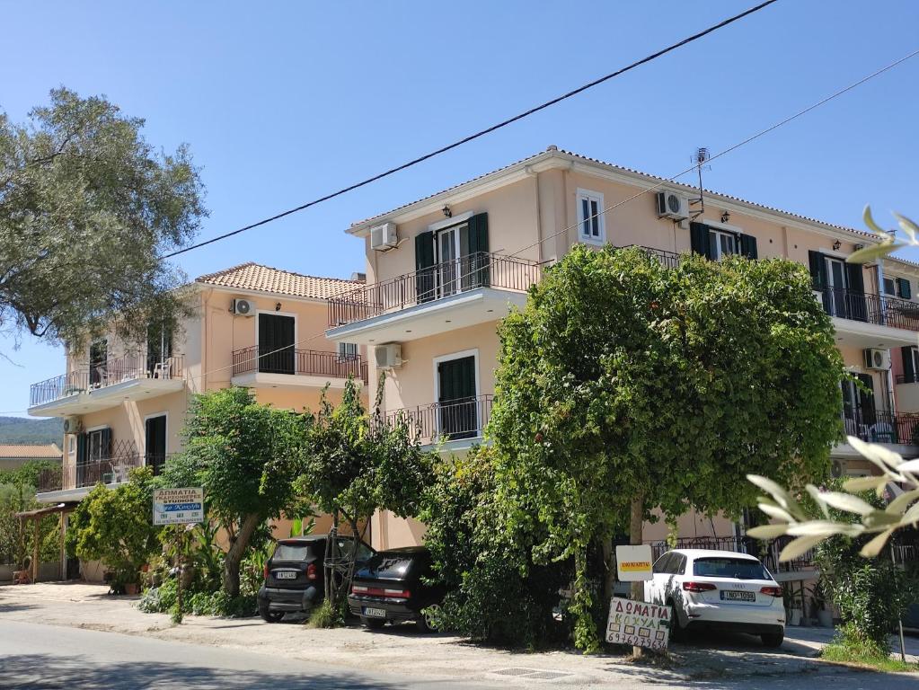 a building with cars parked in front of it at Kohyli in Lefkada Town