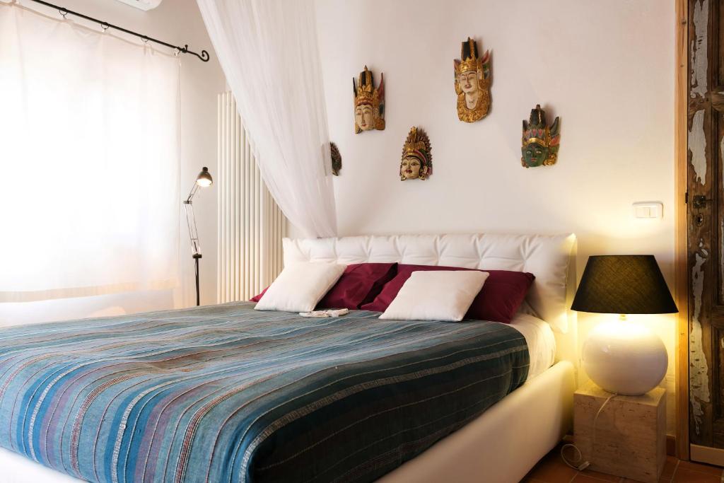 Łóżko lub łóżka w pokoju w obiekcie At Home In Maremma
