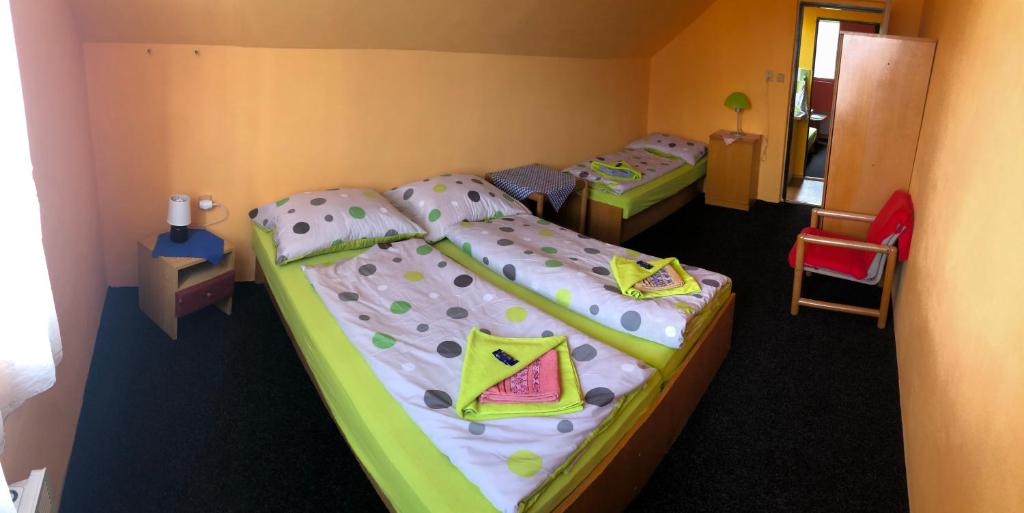 Postel nebo postele na pokoji v ubytování Hotel Na Trojce