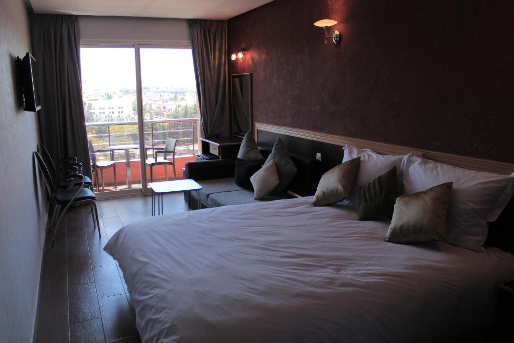 Postel nebo postele na pokoji v ubytování Hôtel Belle Vue et Spa