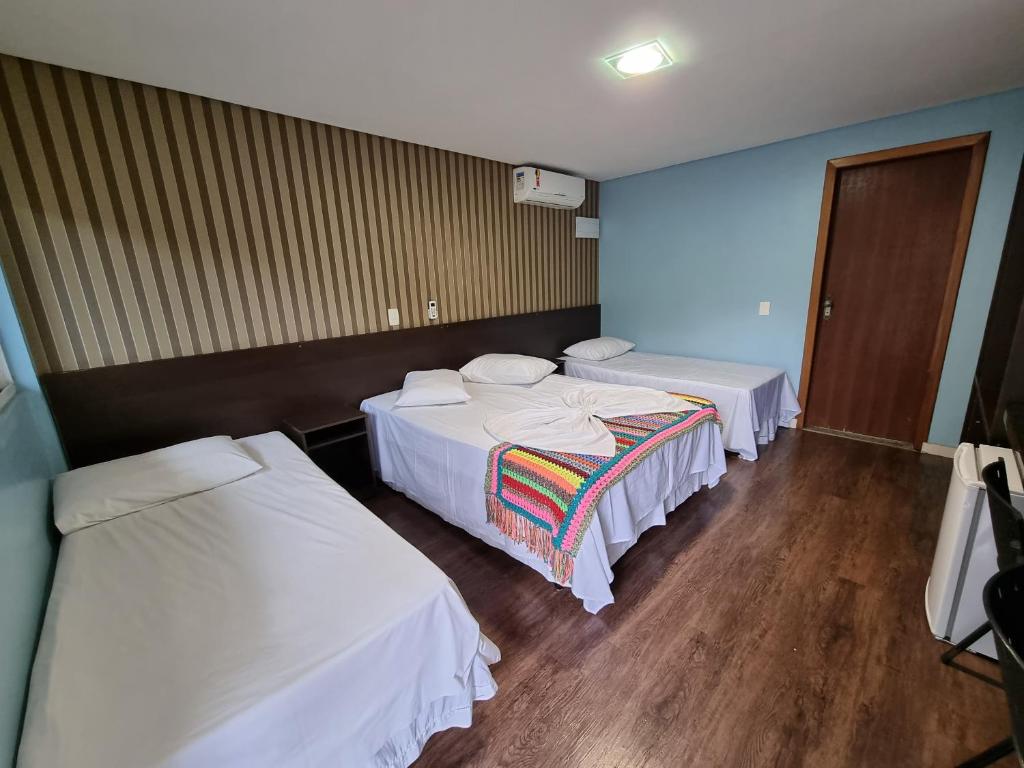Postel nebo postele na pokoji v ubytování Hotel Rouver