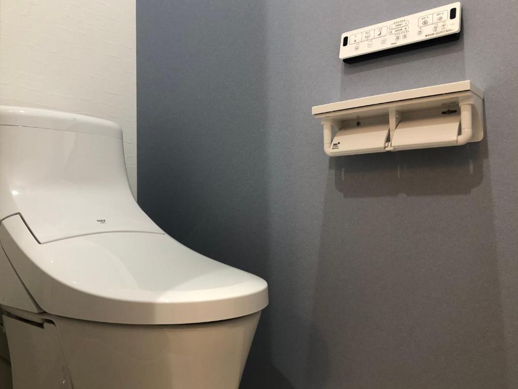 Koupelna v ubytování 民宿 和屋