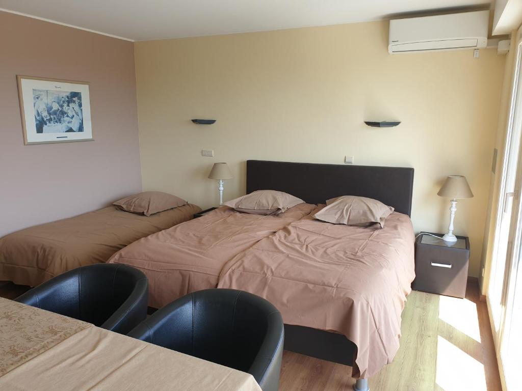Postel nebo postele na pokoji v ubytování Hotel Belvedere