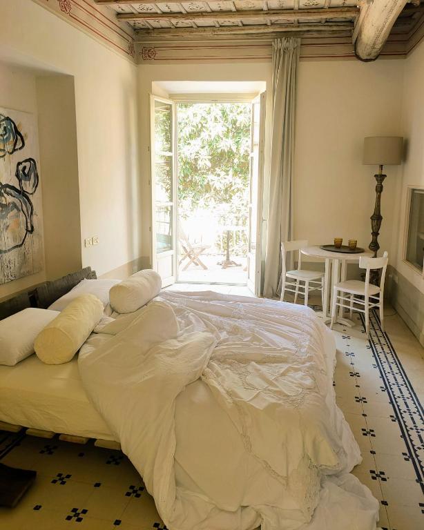Postel nebo postele na pokoji v ubytování Guest House A Via dei Pellegrini