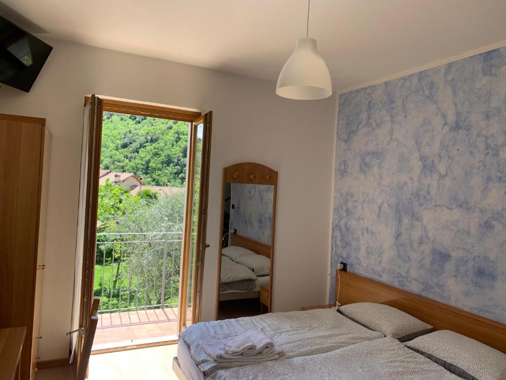 Postel nebo postele na pokoji v ubytování Hotel Garnì Delle Rose