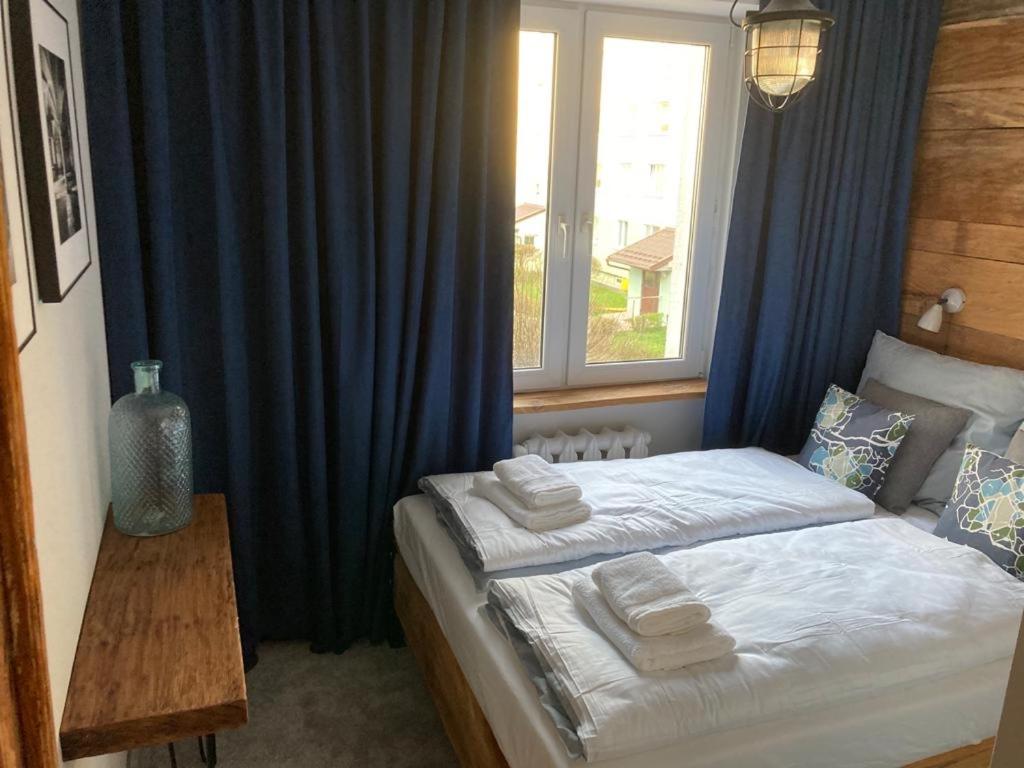 Posteľ alebo postele v izbe v ubytovaní Apartament Komorowskiego