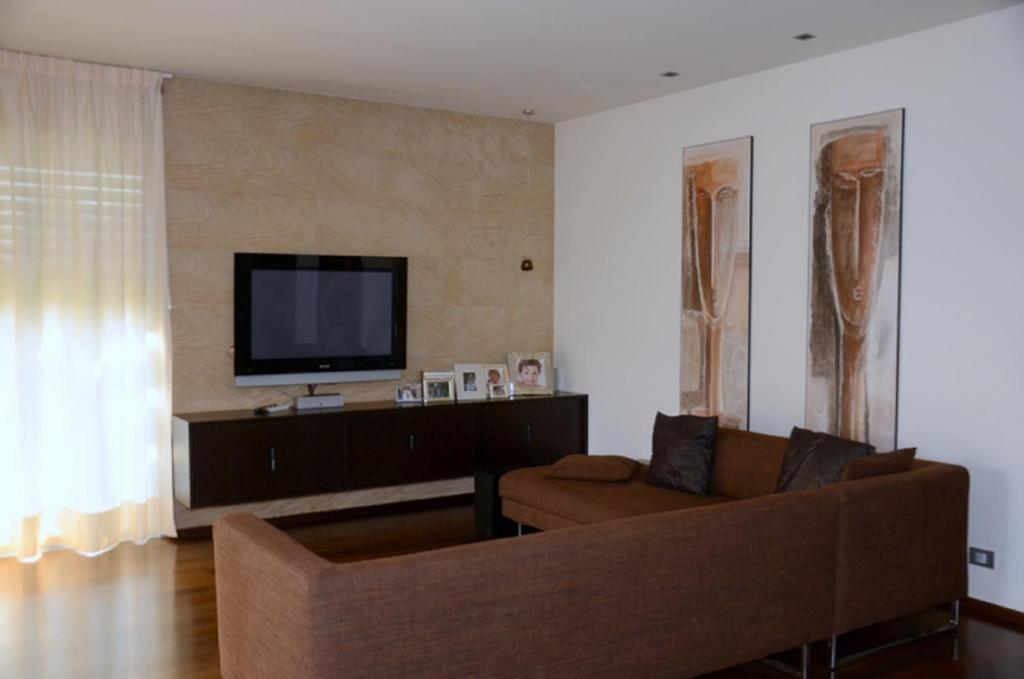 Televízia a/alebo spoločenská miestnosť v ubytovaní Casa Savoia Luxury House