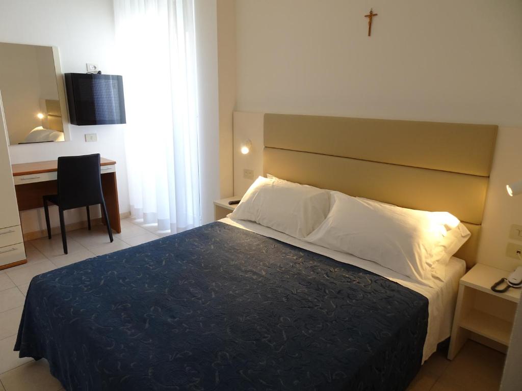 Postel nebo postele na pokoji v ubytování Hotel Atlas