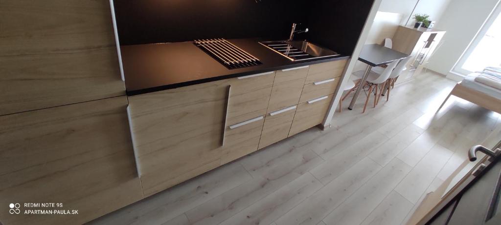 Kuchyň nebo kuchyňský kout v ubytování Apartmán Paula 3