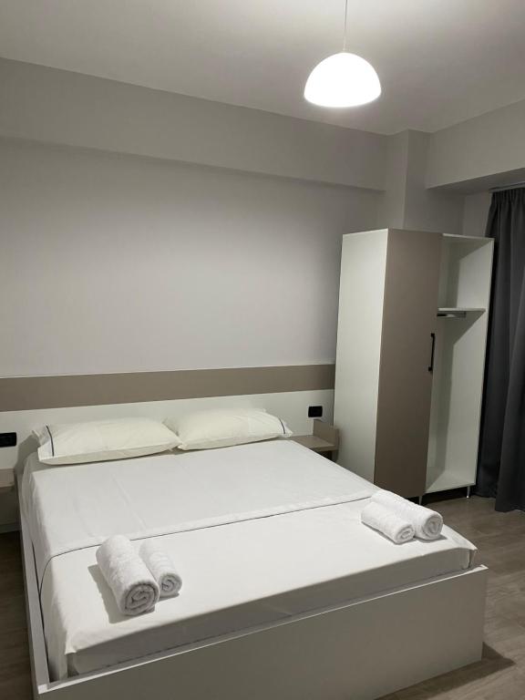 Postel nebo postele na pokoji v ubytování Hotel Cakalli
