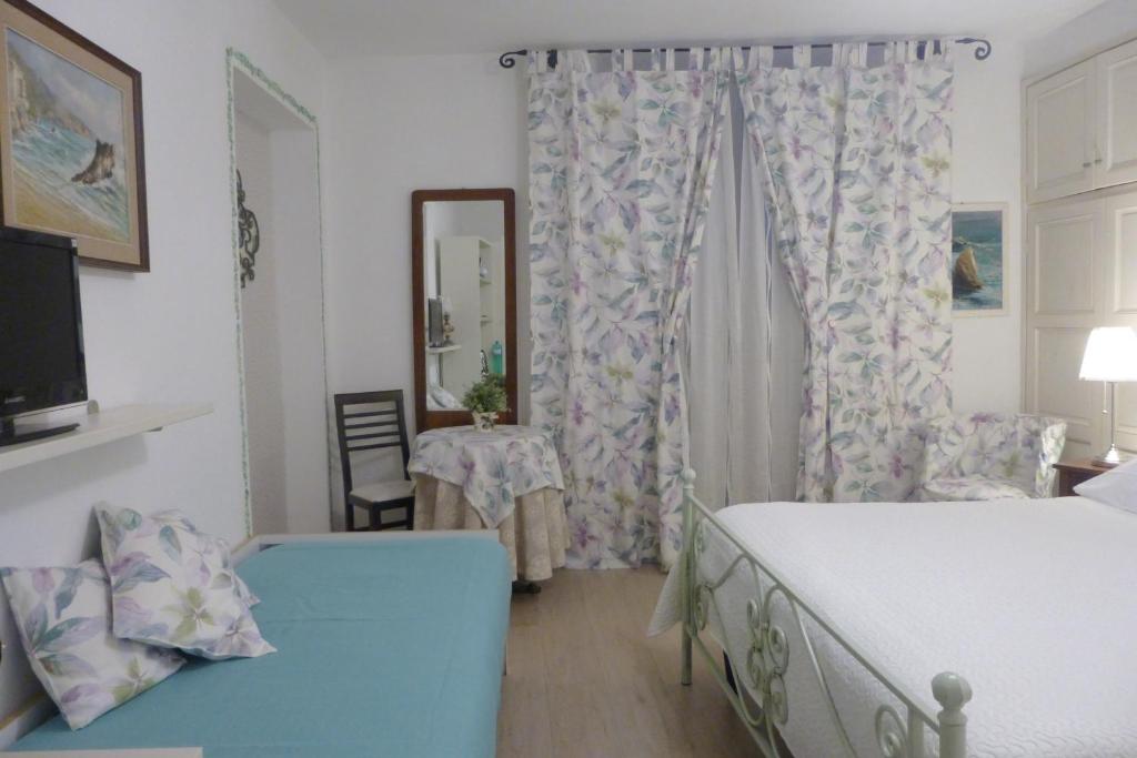 Postel nebo postele na pokoji v ubytování Affittacamere Monica