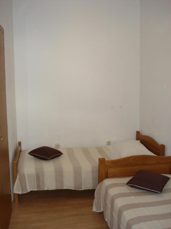 Posteľ alebo postele v izbe v ubytovaní Apartmani Stanić Rosa