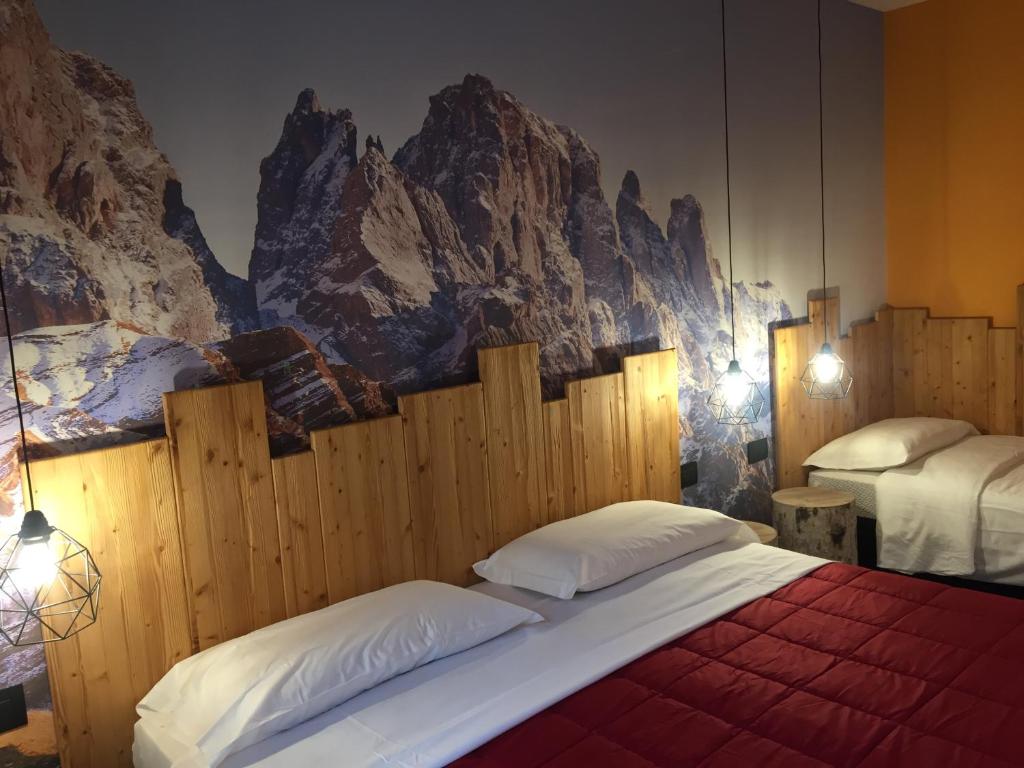 カヴェダーゴにあるCasa Dalsassのベッドルーム1室(ベッド2台付)が備わります。