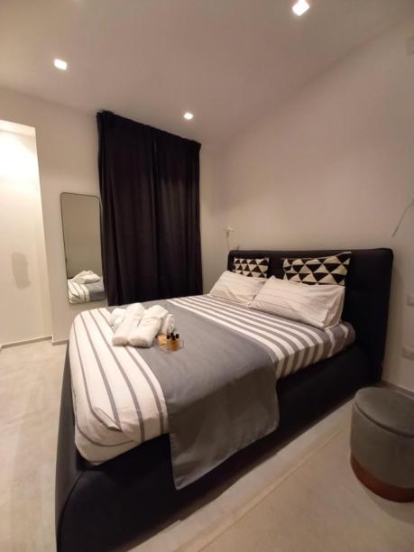 Posteľ alebo postele v izbe v ubytovaní Dimora50 Apartament