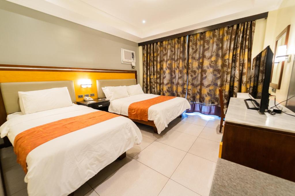 Postel nebo postele na pokoji v ubytování MO2 Westown Hotel Iloilo