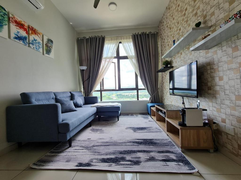a living room with a couch and a tv at E Life D Summit Residences With Wifi & Netflix in Johor Bahru
