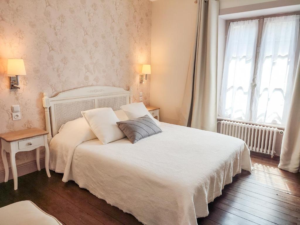 Postel nebo postele na pokoji v ubytování Chambres d'Hotes Le 1900