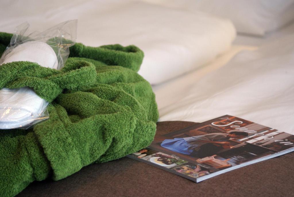 A bed or beds in a room at Ferienhotel Gewürzmühle