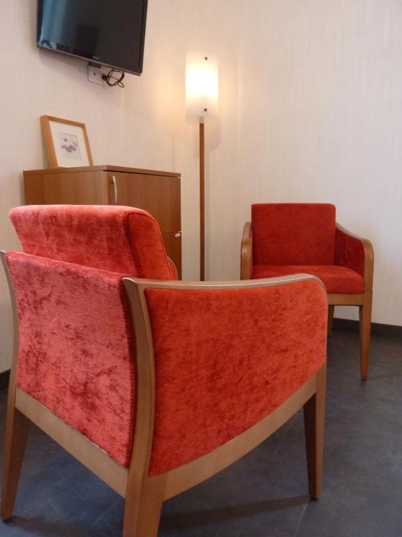 Posezení v ubytování Cit'Hotel de La Vallée