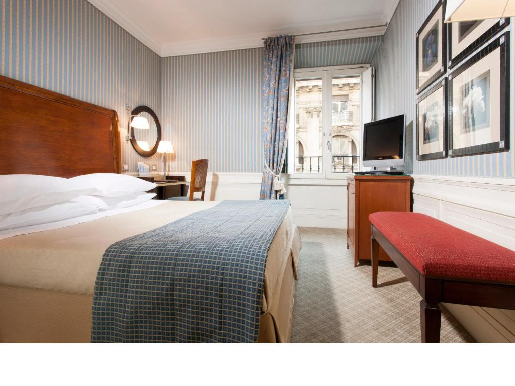 Postel nebo postele na pokoji v ubytování Stendhal Hotel