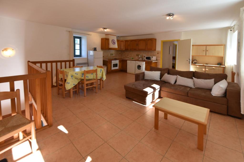 a large living room with a couch and a table at GITE DU COUVENT-Scala in Canari