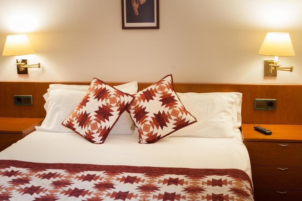 Postel nebo postele na pokoji v ubytování Hostal Restaurant Roma