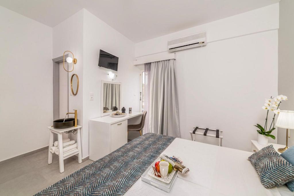 Postel nebo postele na pokoji v ubytování Roxani Hotel