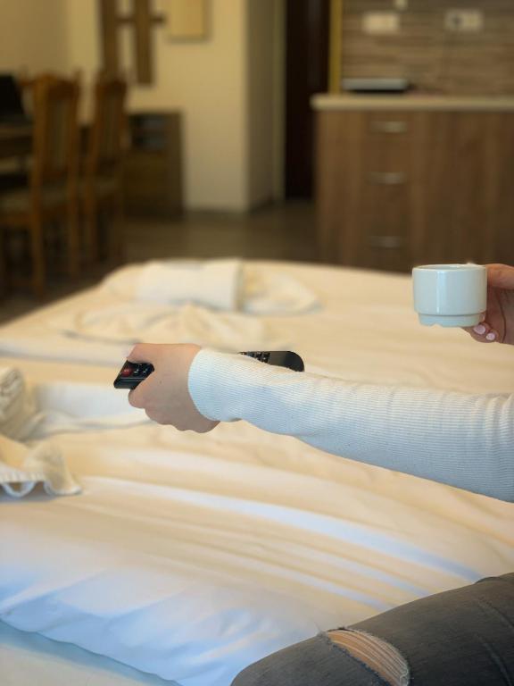 Łóżko lub łóżka w pokoju w obiekcie Aranykorona Apartmanház
