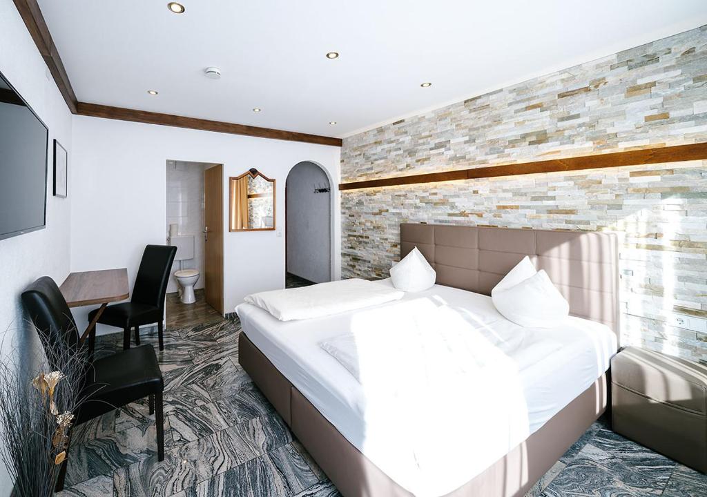 Postel nebo postele na pokoji v ubytování Central City Hotel