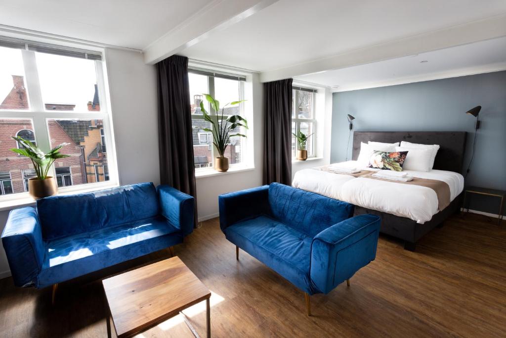 Postel nebo postele na pokoji v ubytování Hotel Markt23