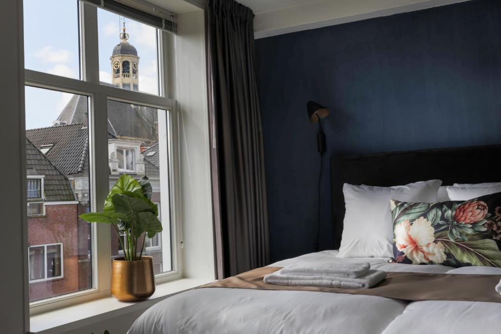 Postel nebo postele na pokoji v ubytování Hotel Markt23