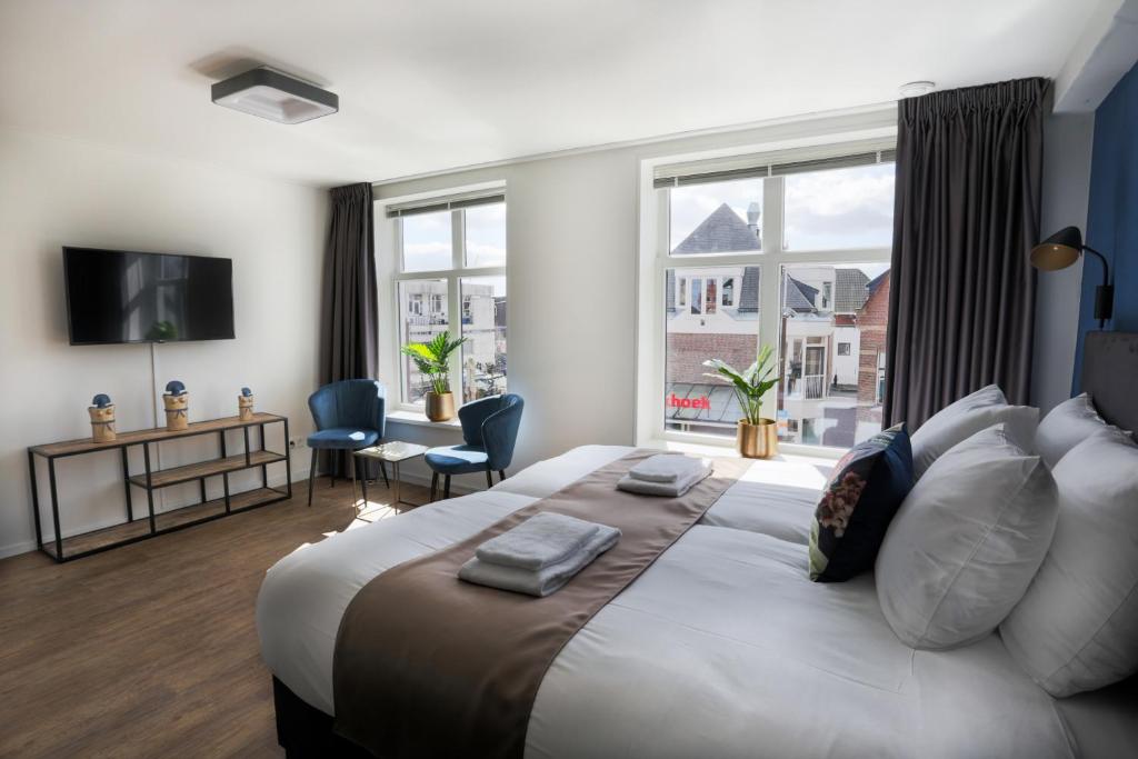 Postel nebo postele na pokoji v ubytování Hotel Markt23