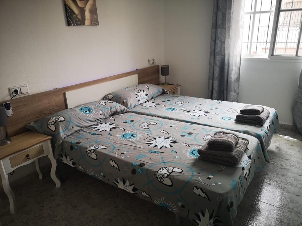 Postel nebo postele na pokoji v ubytování APARTAMENT ORIHUELA COSTA PLAYA FLAMENCA