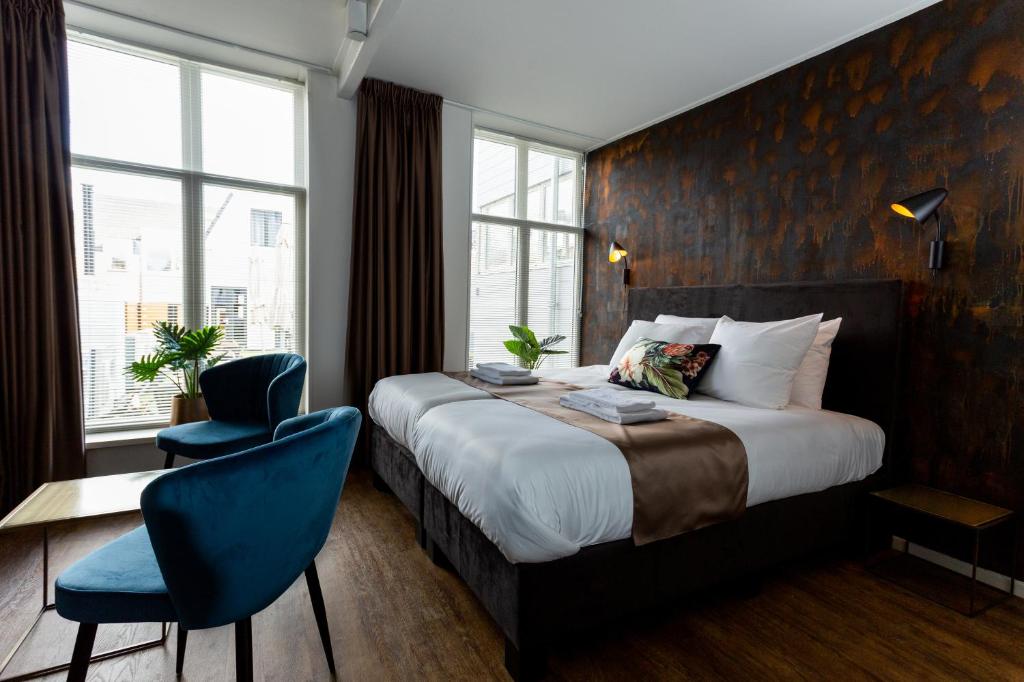 Postel nebo postele na pokoji v ubytování Hotel Markt23