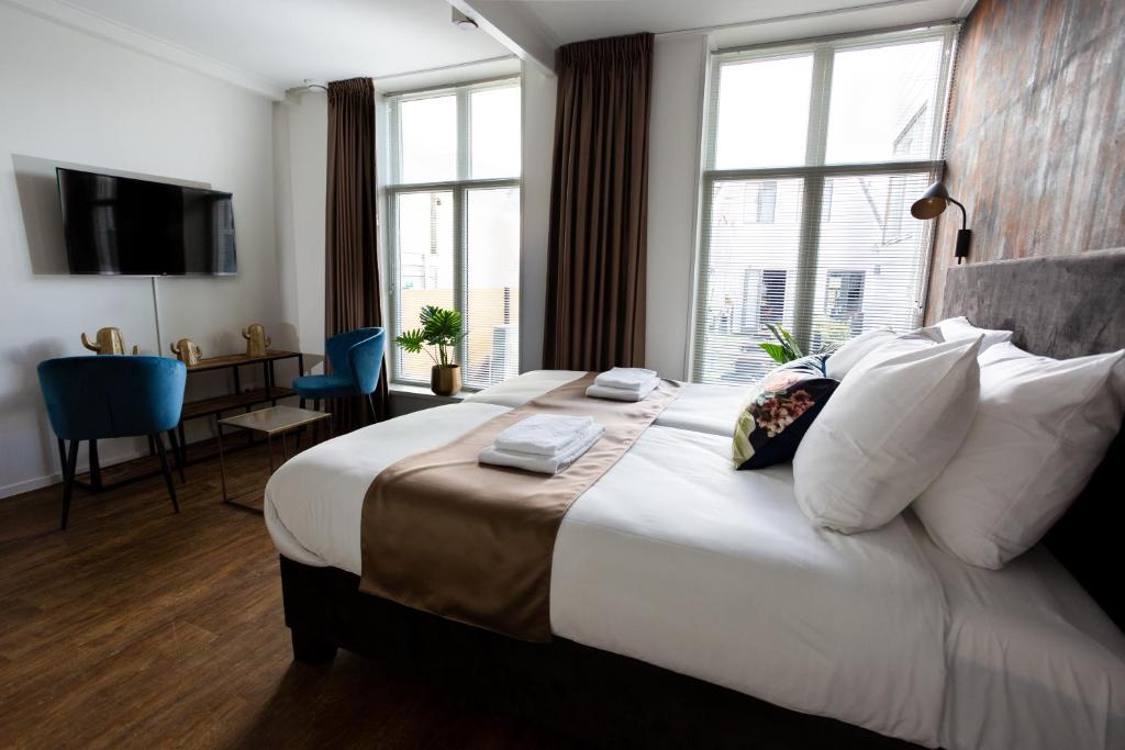 Postel nebo postele na pokoji v ubytování Hotel Markt23