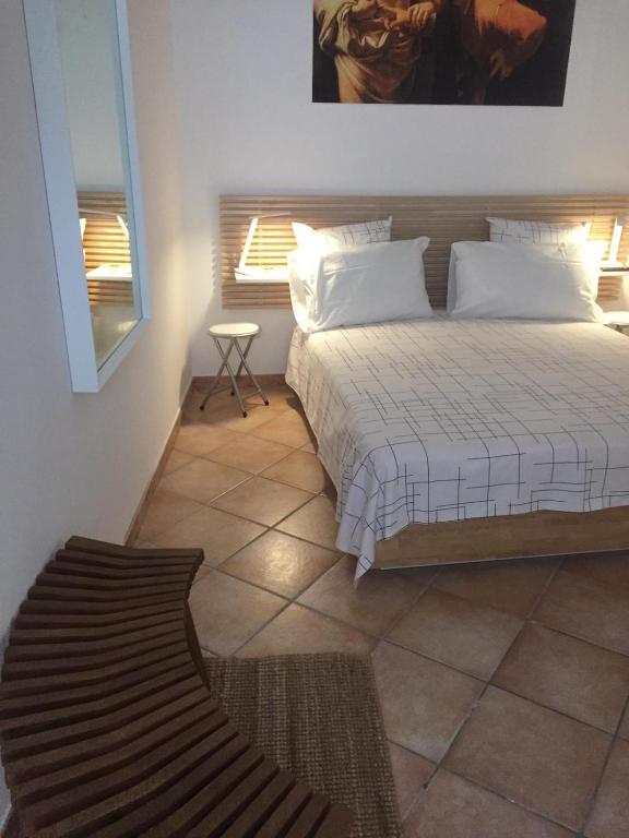 a bedroom with a large bed and a window at CasaTua in Amalfi