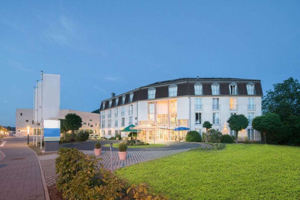 a large building with a dome on top of it at Hotel Lohr am Main in Lohr am Main
