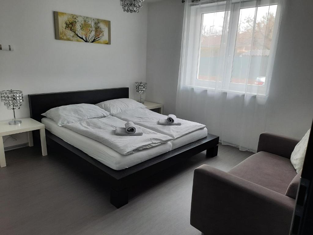 Postel nebo postele na pokoji v ubytování Ela Apartment Vilová