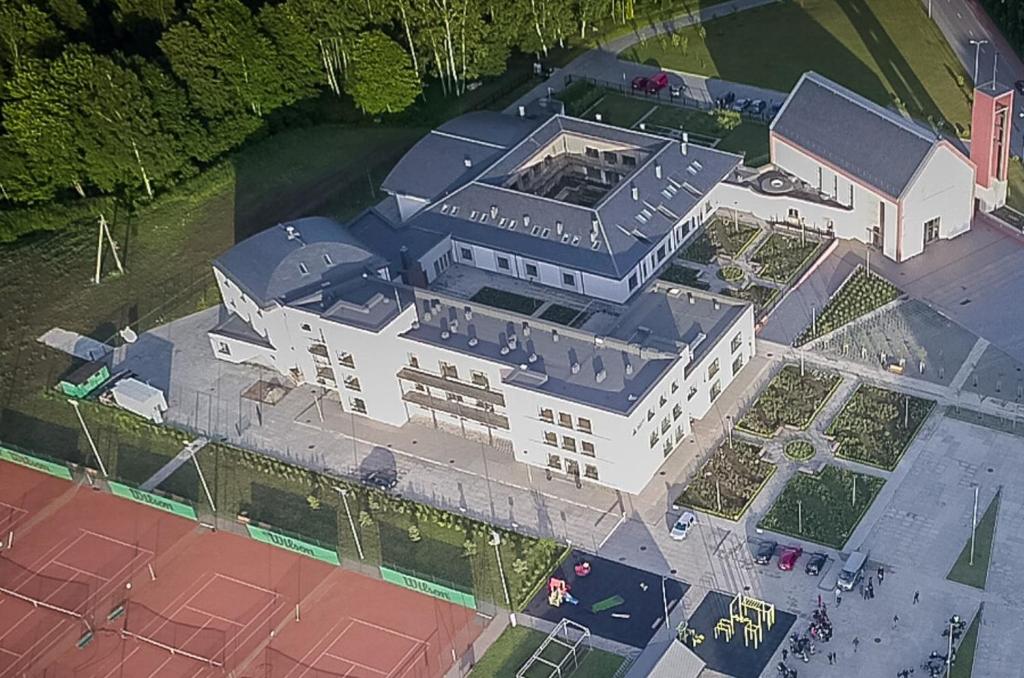 an overhead view of a large white building at Franciscan guest house in Klaipėda