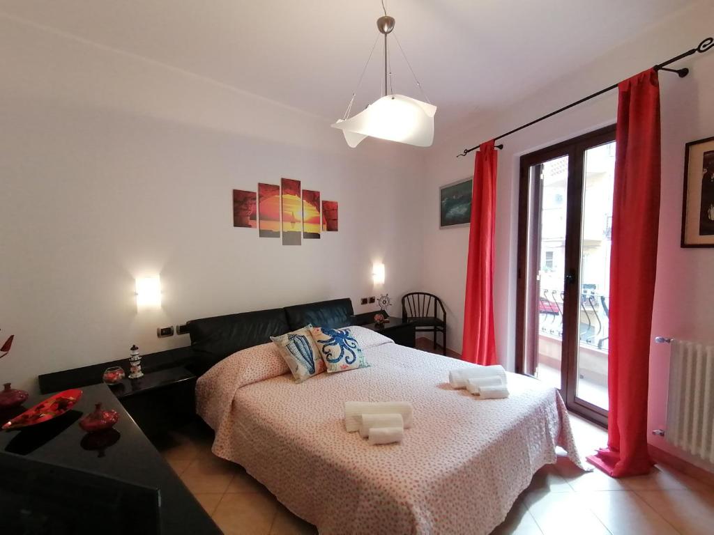 Postel nebo postele na pokoji v ubytování Casa Il Faro