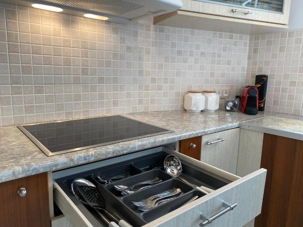 a kitchen with a sink and a dishwasher at PORTA HOME modern and hospitable in Naxos Chora