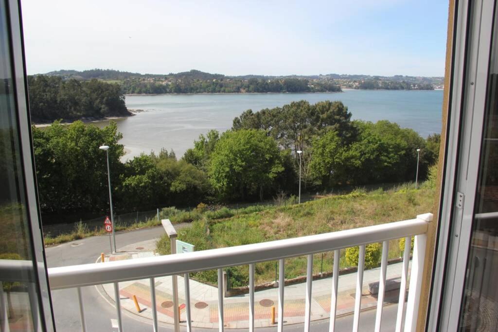 a view of a river from a balcony at Apartamento en Miño con vistas a la Ría. in Miño