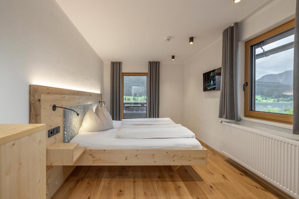 Postel nebo postele na pokoji v ubytování Hotel Winkler-Tuschnig