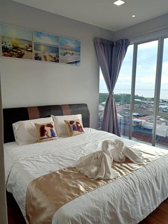 Postel nebo postele na pokoji v ubytování Sekinchan SeaView Homestay 034 高楼看海阳台民宿