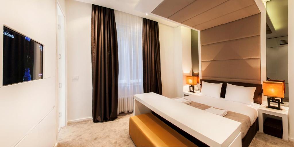 Voodi või voodid majutusasutuse Eden Garden Suites toas