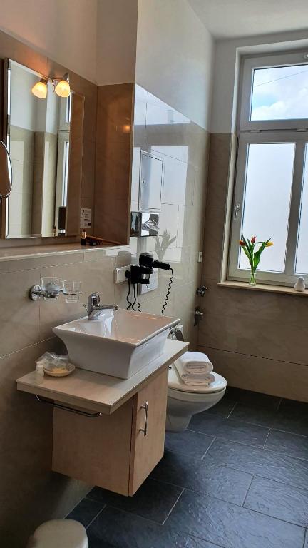 Koupelna v ubytování Hotel Atlas Halle