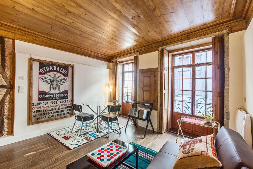 a living room with a couch and a table at Go2Oporto - Historical Center in Porto